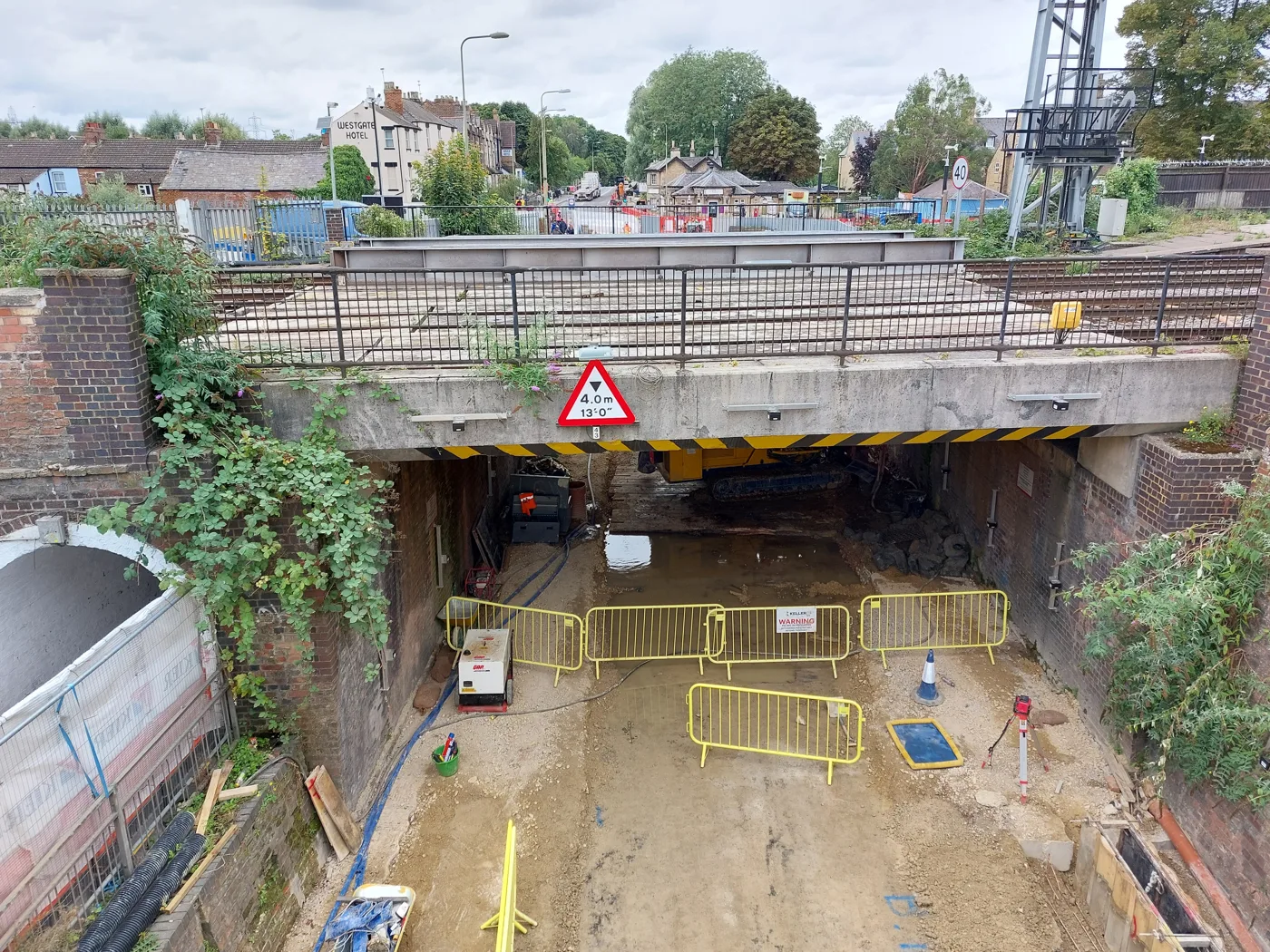Botley Road bridge under reconstruction in August 2023, with the old 4.0 metre height sign still in place
